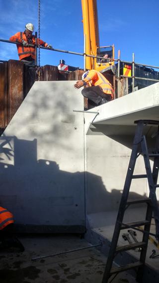 Workers install a box culvert on the western end of The Strand.