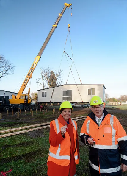 The Hon. Anne Tolley and Whakatāne Mayor Tony Bonne with the keys to the first relocatable buildings.
