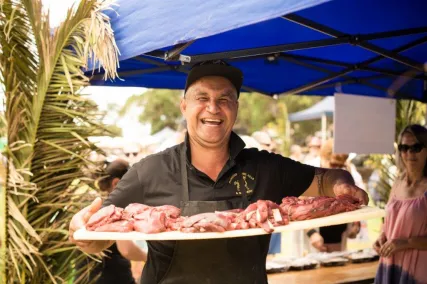 Local Wild Food Challenge guest speaker with tray of meat