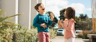 Kids laughing and having ice cream
