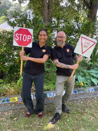 Road safety team with signs